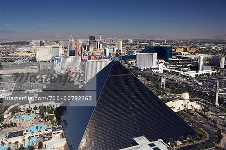 Young girl sitting in Mandalay Bay Hotel room with view of Luxor Hotel and Las  Vegas City Scape in the background Stock Photo - Alamy