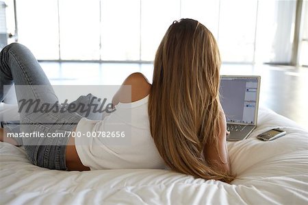 Woman on Bed, Using Laptop