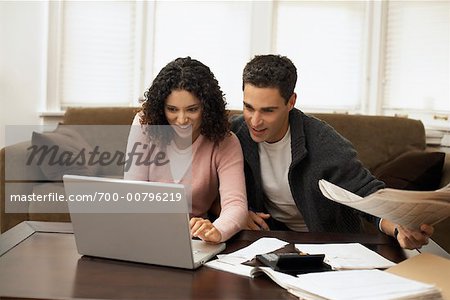 Couple Working on Laptop Computer