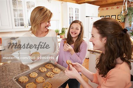 Girls Eating Cookies with Mother