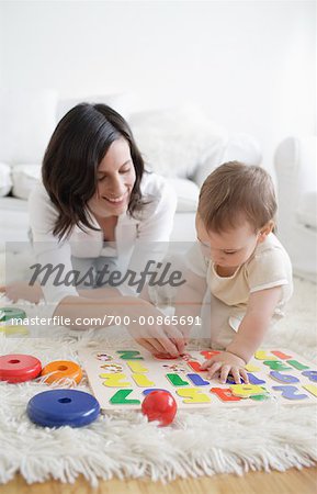 Woman Playing with Son in Living Room