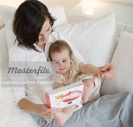 Mother Reading Book with Baby