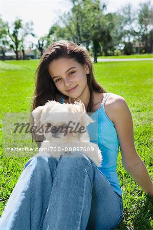 Girl Holding Dog