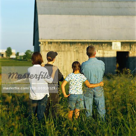 Family Looking at Barn