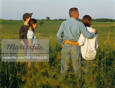 Family Standing in Field