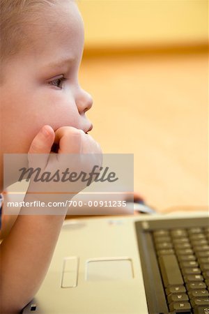 Close-up of Boy Using Laptop Computer