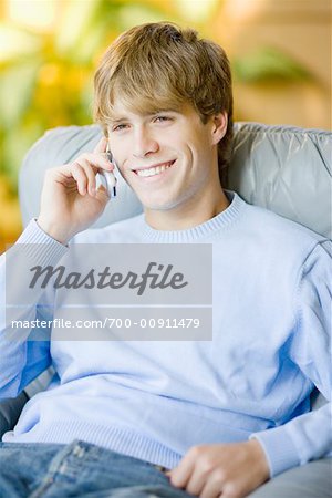 Man in Recliner with Cellular Phone