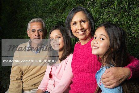 Grandparents With Their Granddaughters Outdoors