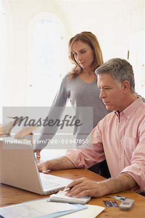 Portrait of Couple Working on Finances