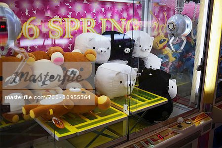 Stuffed Animals in Toy Crane Machine, Tokyo, Japan - Stock Photo