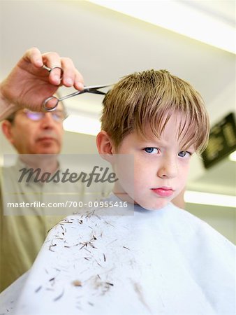 700 00955416em boy getting a haircut stock photo