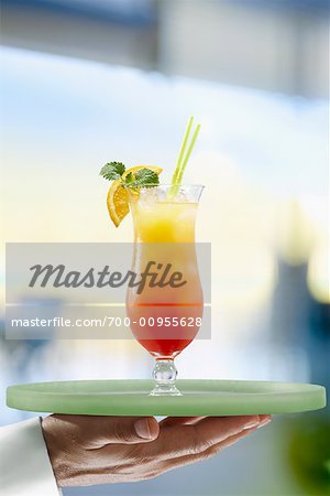 Waiter Carrying a Tequila Sunrise on Tray