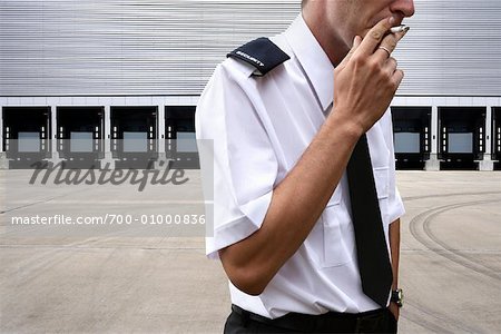 Security Guard Smoking Cigarette