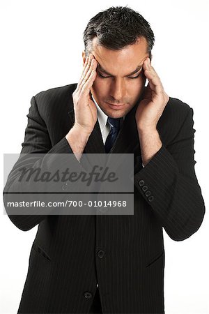 Businessman Rubbing Temples