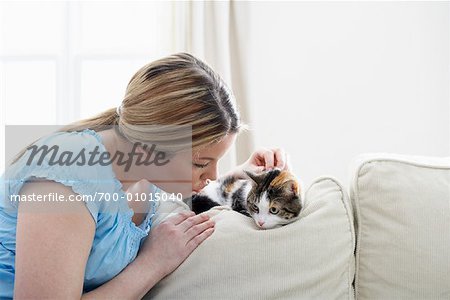 Woman on Sofa with Kitten