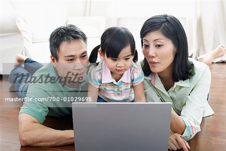 Family Using Lap Top Computer