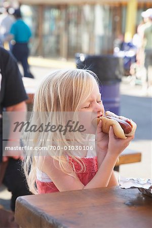 woman eating sausage