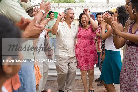 Couple Dancing at Family Gathering