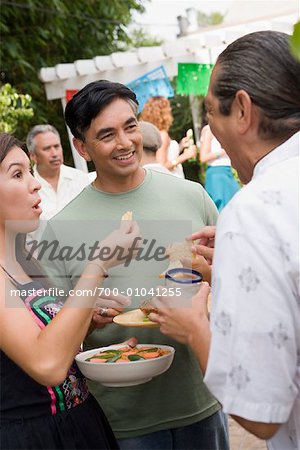 People Eating at Family Gathering