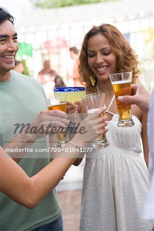 People Drinking at Family Gathering