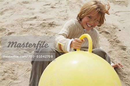Boy Playing with Space Hopper