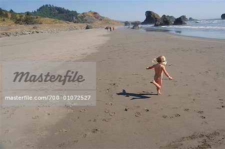 Girl Running at the Beach, Oregon USA