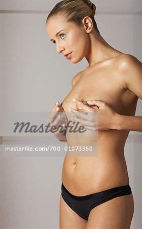 Woman Holding Breast Implants