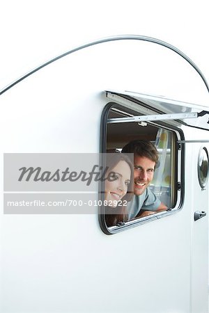 Man and Woman Looking out Trailer window