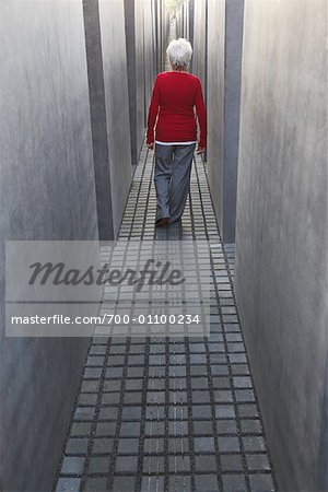 Woman Walking through the Memorial to the Murdered Jews of Europe, Berlin, Germany