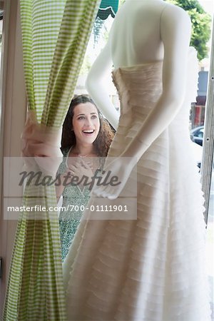 Woman Window Shopping at Bridal Store