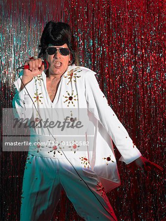 Elvis Impersonator on Stage