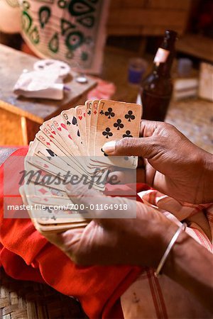 Close-up of Man Holding Cards