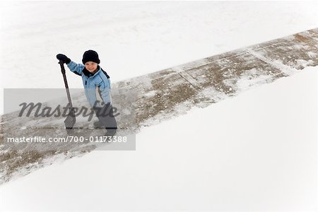 Portrait of Boy Holding Shovel