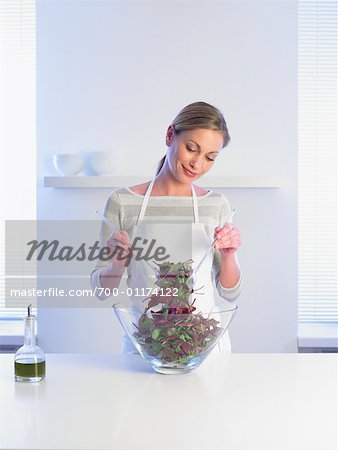 Woman Mixing Salad