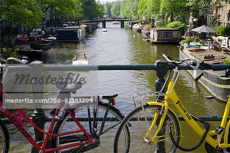 Bikes on Bridge over Canal, Amsterdam, Holland