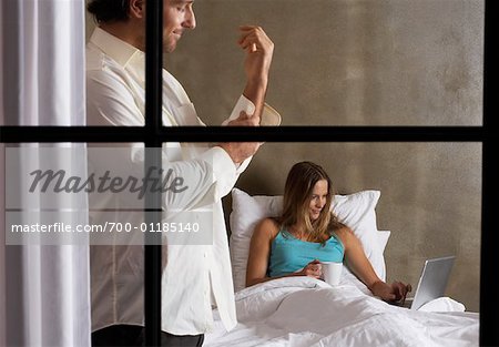 Couple Getting Ready for Bed