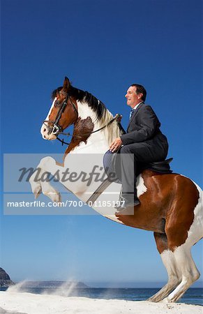 Horse Rearing with Businessman on Its Back