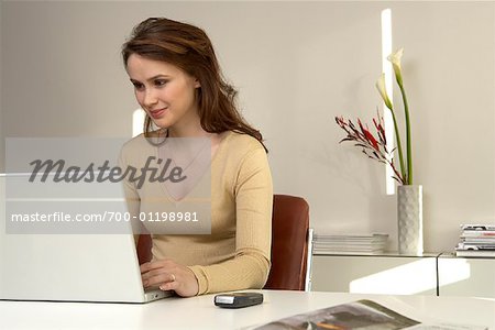 Woman in Office, Using Laptop Computer