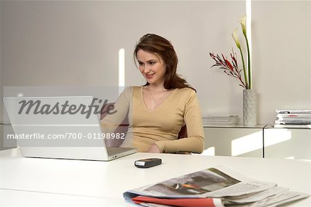 Woman in Office, Using Laptop Computer