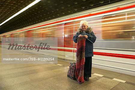 Woman Knitting at Subway Station