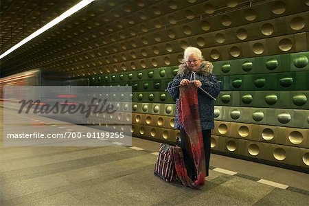 Woman Knitting at Subway Station