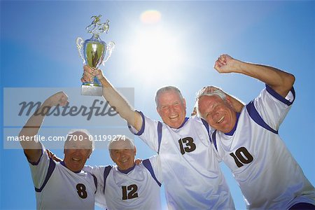 Soccer Players With Trophy