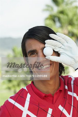 Portrait of Man Holding Golf Ball