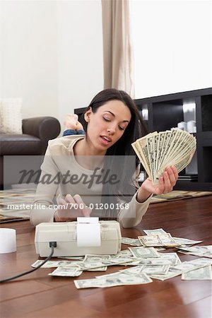 Woman Counting Money at Home