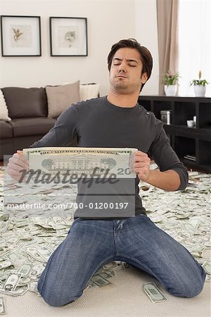 Man Stretching 20 Dollar Bill