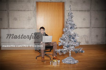 Portrait of Man with Christmas Tree