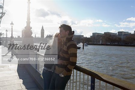 Couple by the Thames River, London, England