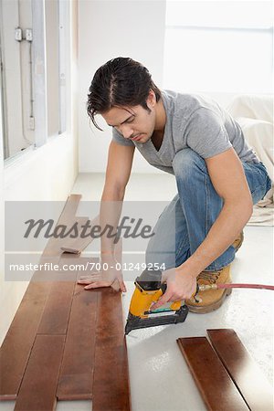 Man Installing Floorboards