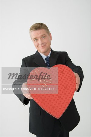 Businessman Holding Heart-Shaped Box