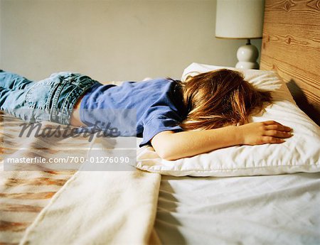 Girl Lying on Bed - Stock Photo - Masterfile - Rights-Managed ...